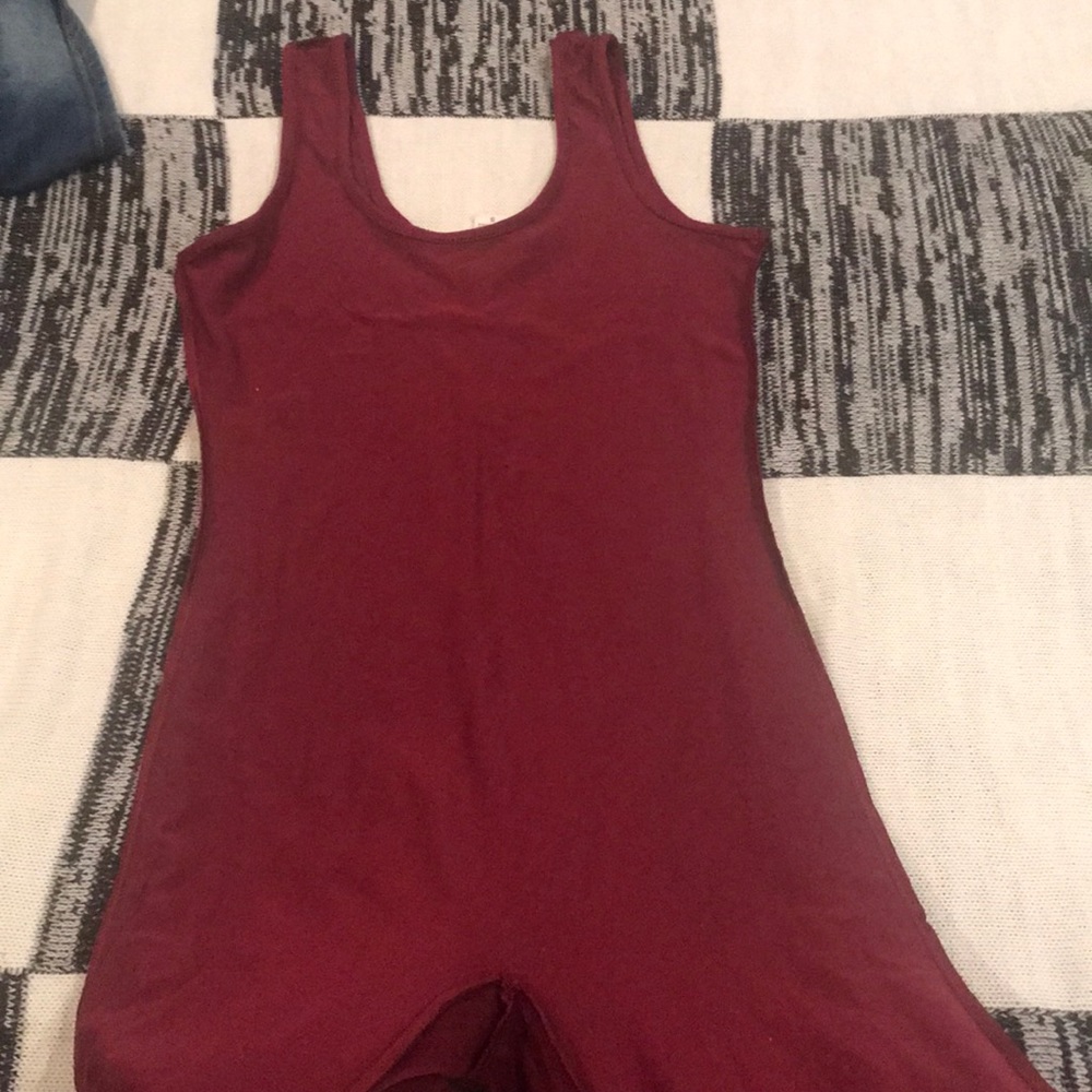 Maroon body jump suit size small/ medium